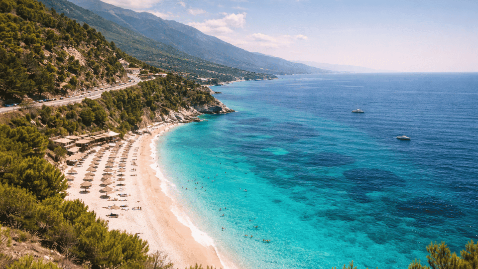 Turquoise waters and white pebble beaches along the Albanian Riviera Mediterranean coast